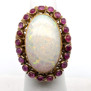 Opal Cabochon Ring with Ruby Halo in 14KYG