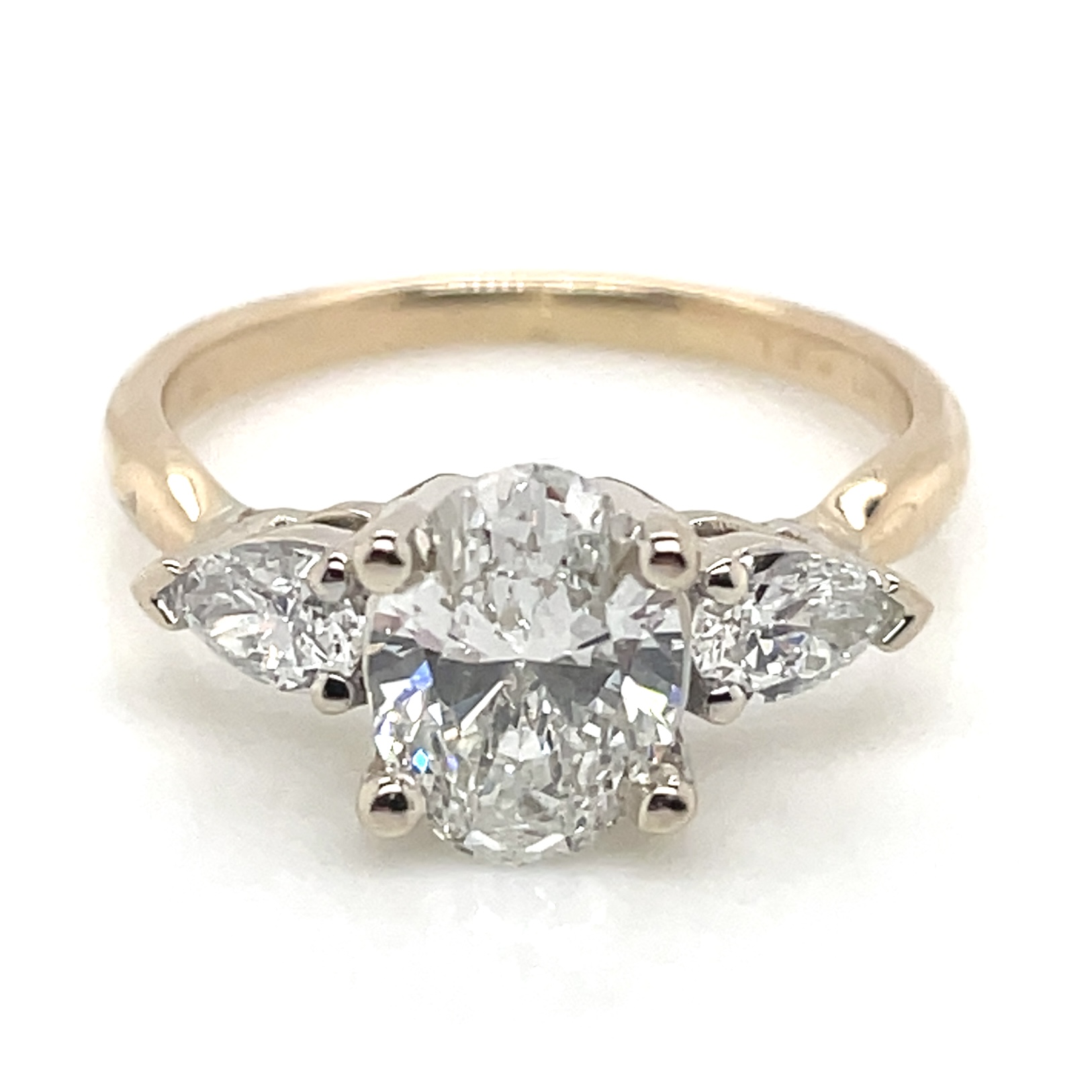 1.01 Carat Oval Center Stone Diamond Ring With 0.32ctw Pear Shape Accents in 18KYG