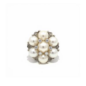 White gold diamond and pearl cluster ring featuring 7 pearls and 12 diamonds.